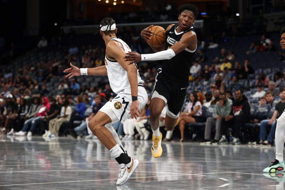 Memphis Grizzlies forward GG Jackson (45) drives to the basket as Denver Nuggets forward Zeke Nnaji (22) defends during the second half at FedExForum on April 14, 2024.