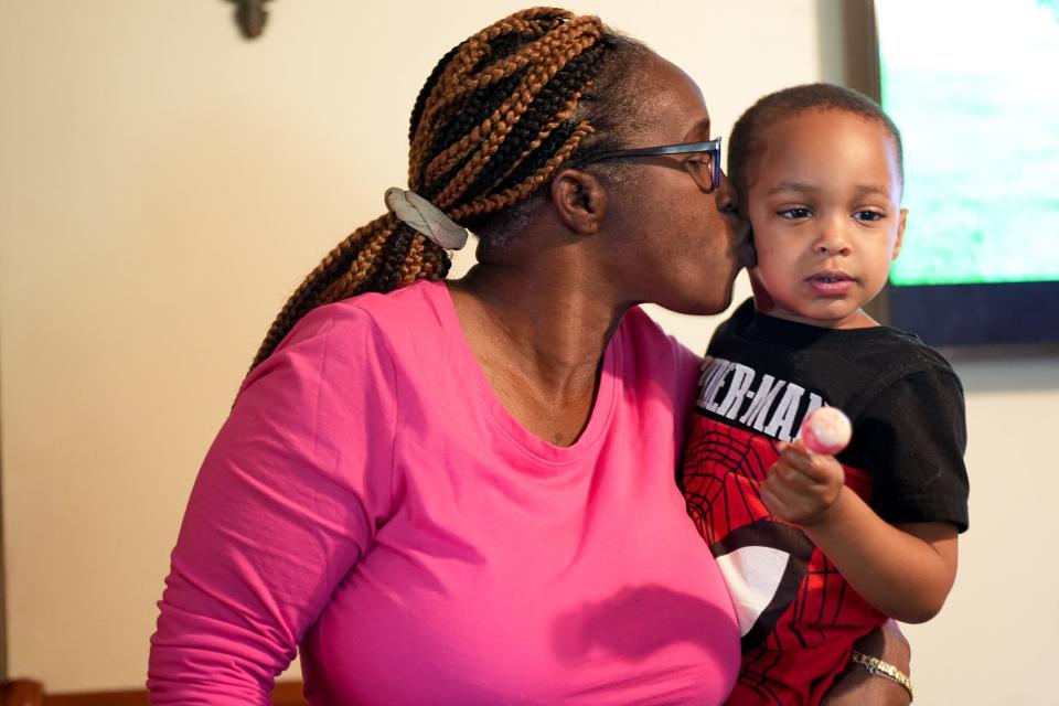 Tracey Piper holds her great-nephew Zaire Piper, whom she adopted. The grandmother from Bastrop continues to help her family through medical struggles as well as work in a nursing home.