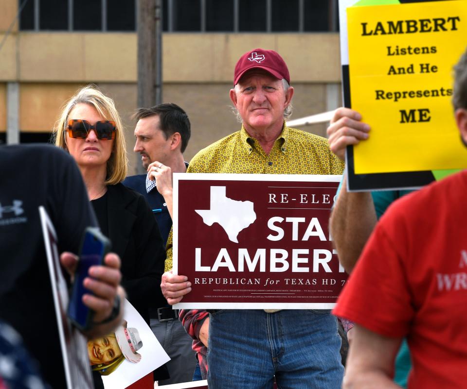 Abilene Mayor Weldon Hurt stands holding a sign supporting District 71 Rep. Stan Lambert in next week’s Republican primary, Tuesday.