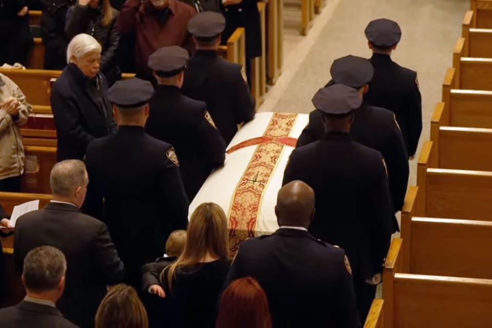 Diller’s casket being brought into the church at the beginning of the funeral. NYPD