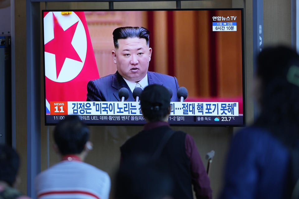 People watch a TV screen showing a news program reporting with a file footage of North Korean leader Kim Jong Un, at the Seoul Railway Station in Seoul, South Korea, Friday, Sept. 9, 2022. North Korean leader Kim stressed his country will never abandon the nuclear weapons it needs to counter the United States, which he accused of pushing to weaken the North's defenses and eventually collapse his government, state media said Friday. (AP Photo/Lee Jin-man)
