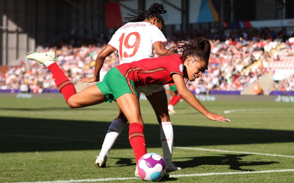 Soccer Football - Women's Euro 2022 - Group C - Portugal v Switzerland - Leigh Sports Village, Leigh, Britain - July 9, 2022 Switzerland's Eseosa Aigbogun in action with Portugal's Jessica Silva - Molly Darlington/Reuters