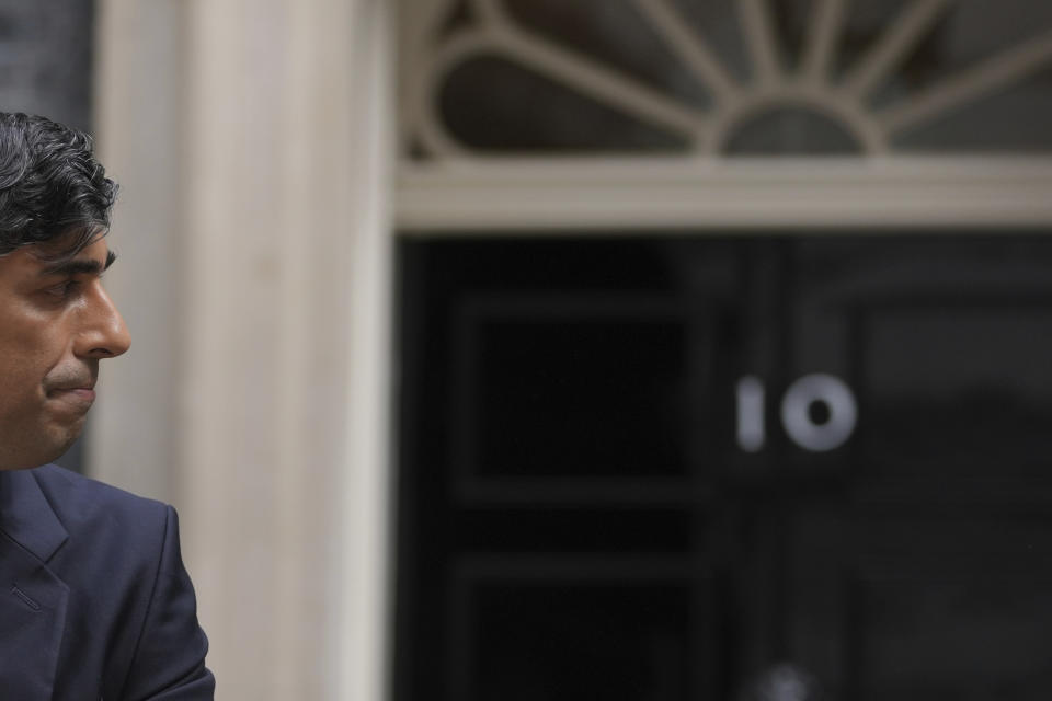 Britain's outgoing Conservative Party Prime Minister Rishi Sunak turns away after speaking outside 10 Downing Street before going to see King Charles III to tender his resignation in London, Friday, July 5, 2024. Sunak and his Conservative Party lost the general election held July 4, to the Labour Party, whose leader Keir Starmer is set become Prime Minister later Friday. (AP Photo/Kin Cheung)