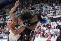 Stanford guard Talana Lepolo, left, is fouled by South Carolina forward Aliyah Boston, right, during the first half of an NCAA college basketball game in Stanford, Calif., Sunday, Nov. 20, 2022. (AP Photo/Godofredo A. Vásquez)