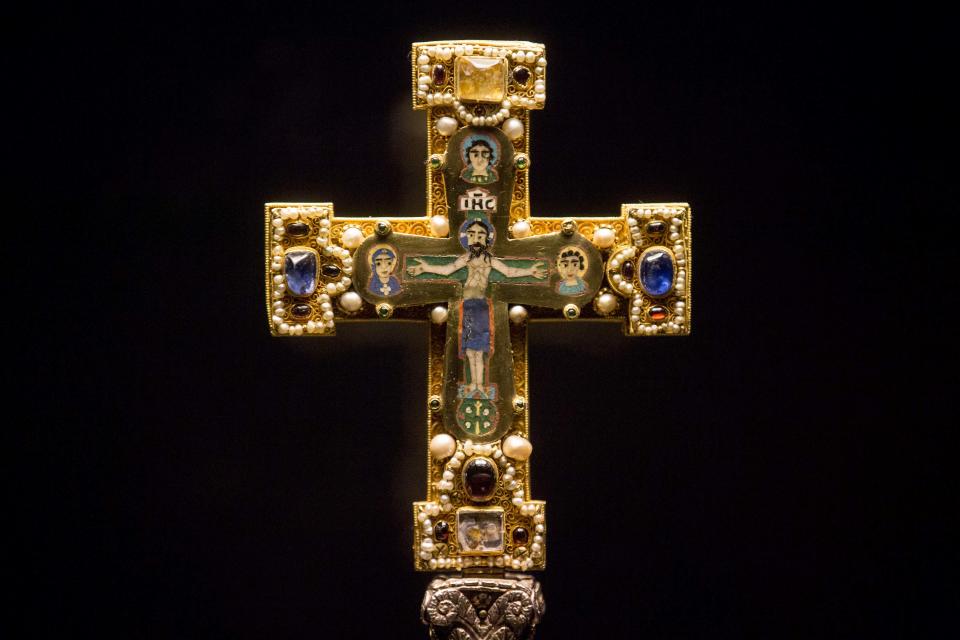 In this picture taken Jan. 9, 2014 a medieval Cross, part of the Welfenschatz, is displayed at the Bode Museum in Berlin. One of Germany’s most precious collections of medieval Christian art is at the center of a complicated ownership dispute between the foundation that oversees the Berlin museums and the heirs of Jewish art dealers who claim their ancestors had to sell the objects to the Nazis under pressure in 1935. For years, both sides have claimed they’re the legitimate owners, arguing their cases without finding a successful solution, so on Wednesday Jan 15, 2014 , in a highly anticipated meeting, a German government-created commission will come together to make a recommendation on who should rightfully own the so-called Welfenschatz -or Guelph Treasure. ( AP Photo/Markus Schreiber)