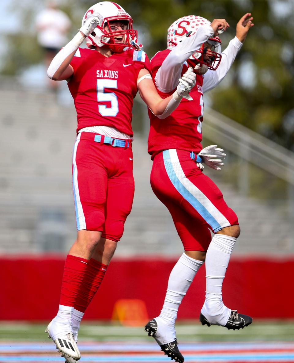 South Salem's Eli Johnson (5) and Tini Tinitali III (1) celebrate an interception during the game against Grants Pass on Saturday, Sept. 17, 2022 in Salem, Ore.