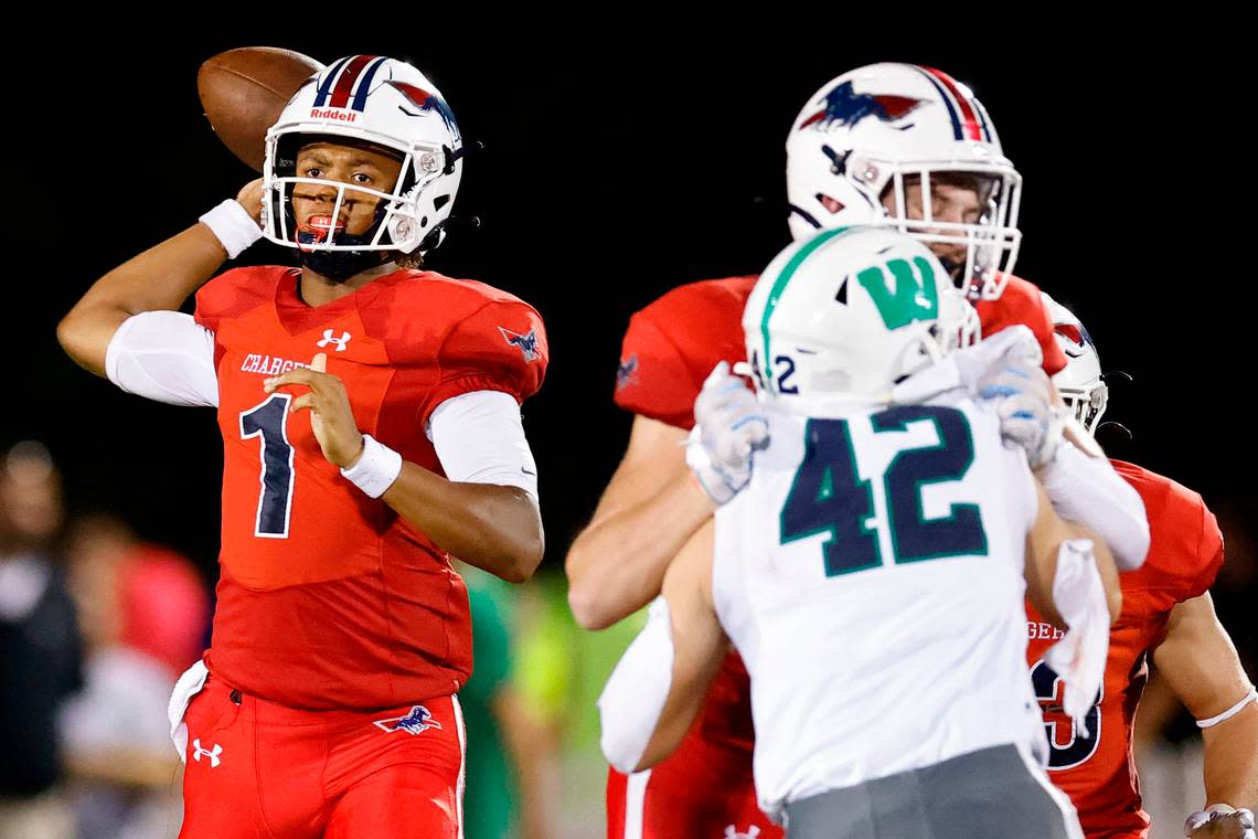 Providence Day’s Jadyn Davis (1) passes the ball over Weddington defense during a game at Providence Day in Charlotte, N.C., Friday, Aug. 26, 2022.