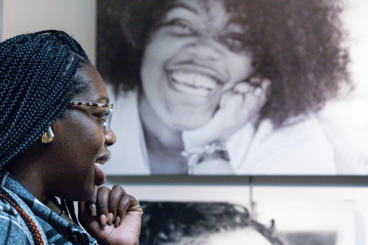 With a photo of Emmisha S. featured nearby, Imani Townsell looks at a photo of her best friend at the "Poetic Justice: Voices From the Inside" exhibit at Oklahoma City University's Norick Art Center in Oklahoma City.