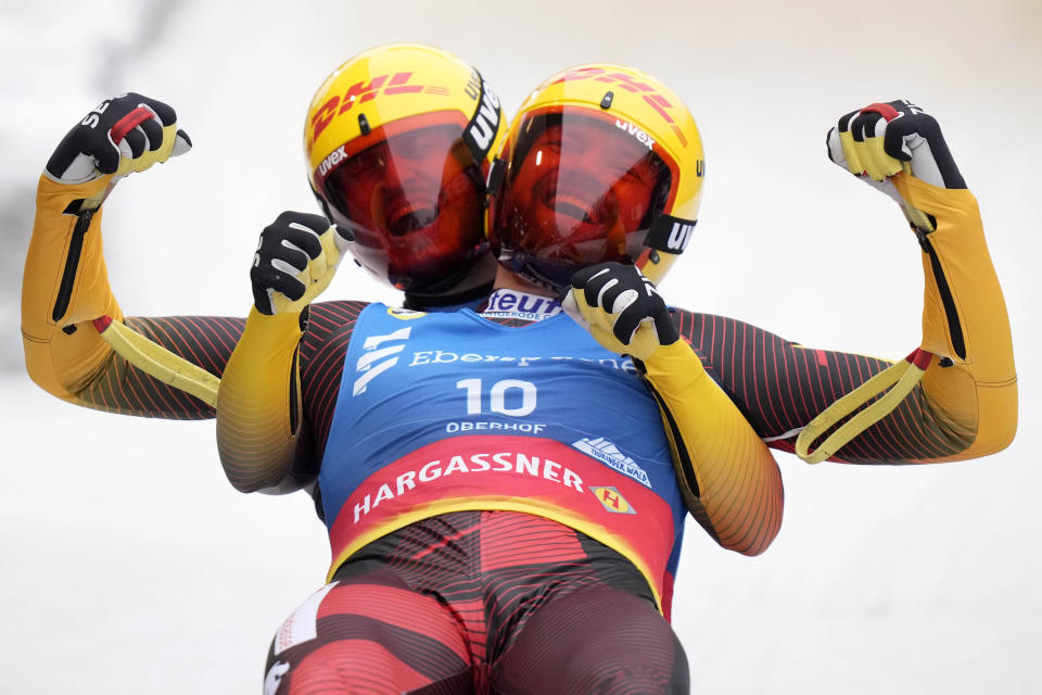 Toni Eggert and Sascha Benecken of Germany celebrate winning the men's doubles race at the Luge World Championships in Oberhof, Germany, Saturday, Jan. 28, 2023. (AP Photo/Matthias Schrader)