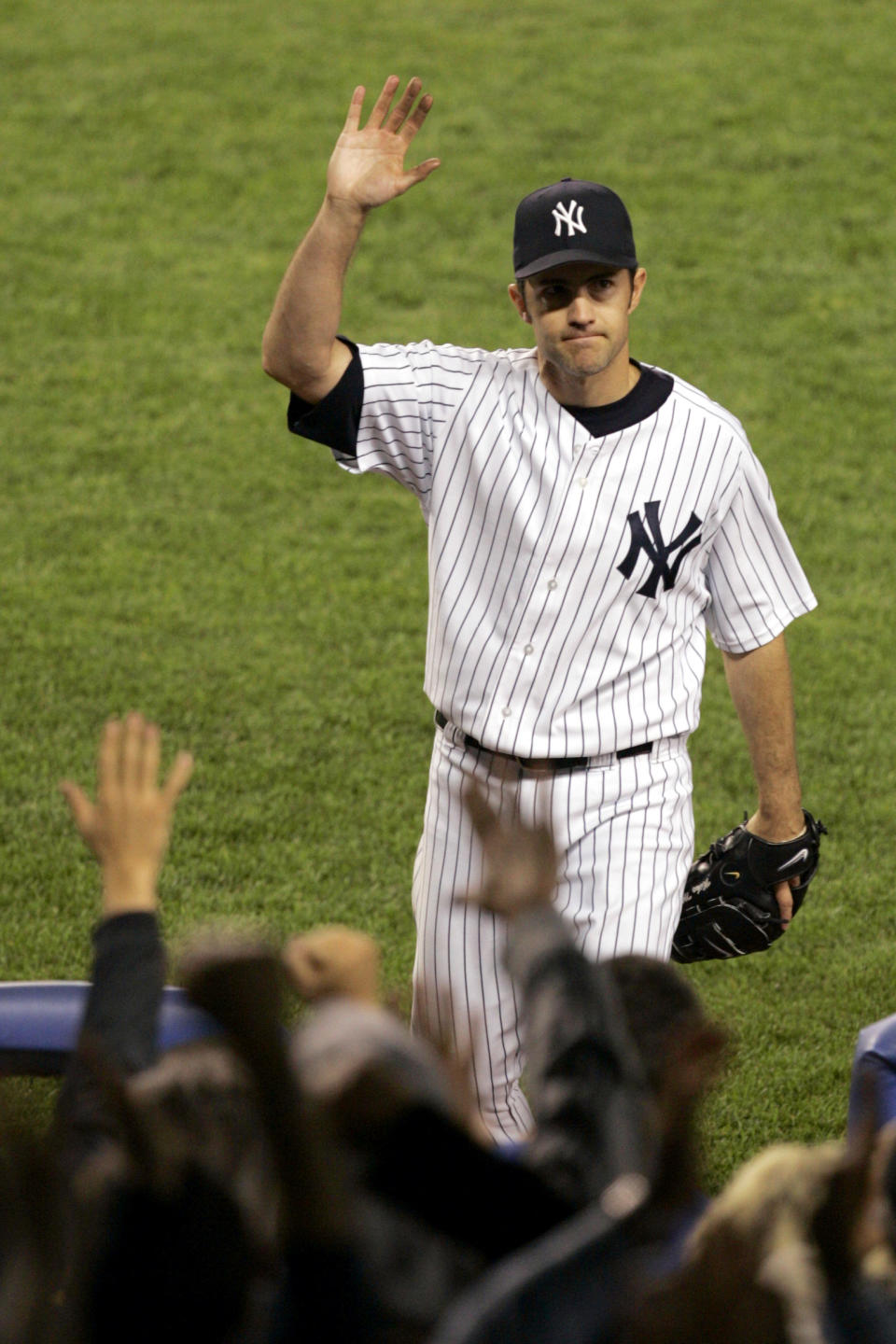 FILE - In this May 10, 2006, file photo, New York Yankees pitcher Mike Mussina waves to the crowd while leaving the game during the seventh inning against the Boston Red Sox at New York's Yankee Stadium. Mussina will be inducted into the Baseball Hall of Fame on Sunday, July 21, 2019. (AP Photo/Frank Franklin II, File)