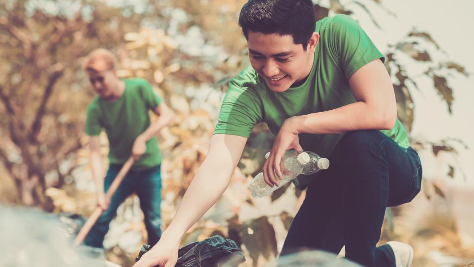 student volunteering to pick up trash