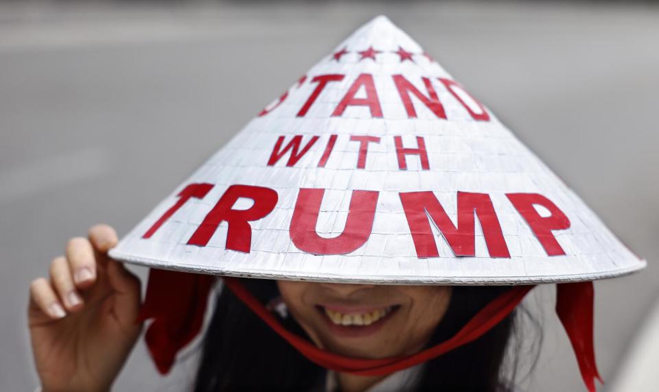 Kimberly Nguyen of North Pasadena wears a Vietnamese traditional hat she custom made