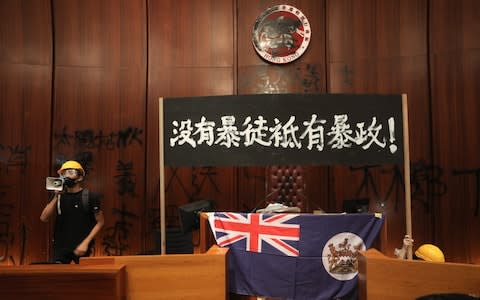 Anti-government protesters stormed Hong Kong's parliament building  - Credit: VIVEK PRAKASH/AFP/Getty Images