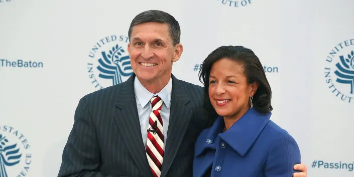 Former National Security Advisor Michael Flynn shakes hands with his predecessor, Susan Rice at the Passing The Baton conference in Washington, DC on January 10, 2017.
