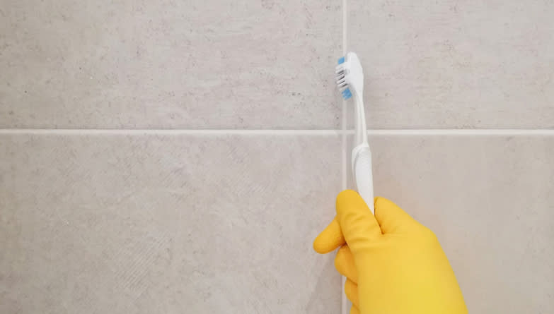 a person cleaning with a toothbrush