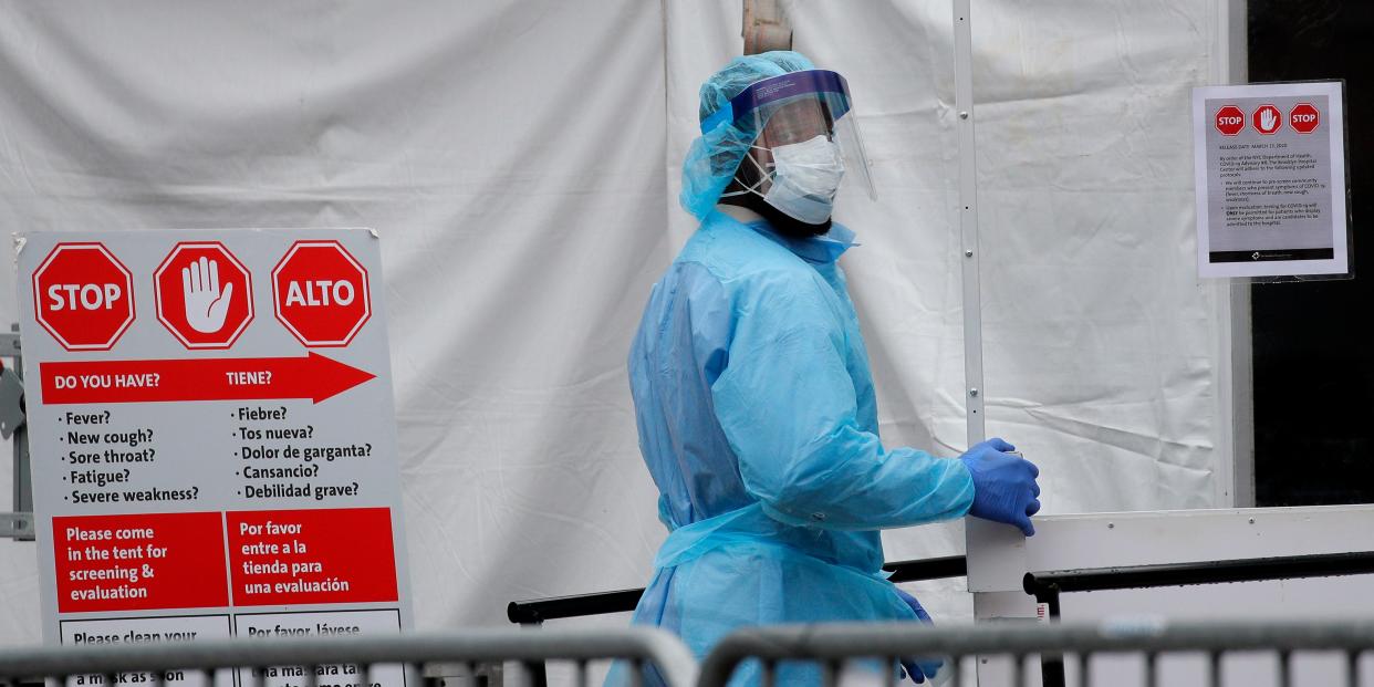 A healthcare worker in protective equipment enters The Brooklyn Hospital Center during the coronavirus disease (COVID-19) outbreak in the Brooklyn borough of New York City, New York, U.S., March 31, 2020. REUTERS/Brendan Mcdermid