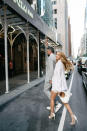 <p>Love and Bock start their wedding weekend with a welcome dinner at New York City's Polo Bar. Bock wears a white one-shoulder Oscar de la Renta dress and blazer with matching Stuart Weitzman shoes, while Love wears a custom, pearl gray Ralph Lauren suit, vintage Ralph Lauren lapel pin and a Vacheron Constantin 222 watch, which was a limited re-release of the iconic 1977 style.</p>