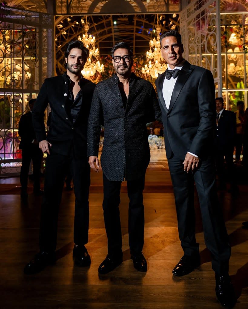 Some of India’s biggest names also turned out to party at the billionaire’s bash, including Bollywood stars Ajay Devgn (center) and Akshay Kumar (right). Reliance/AFP via Getty Images