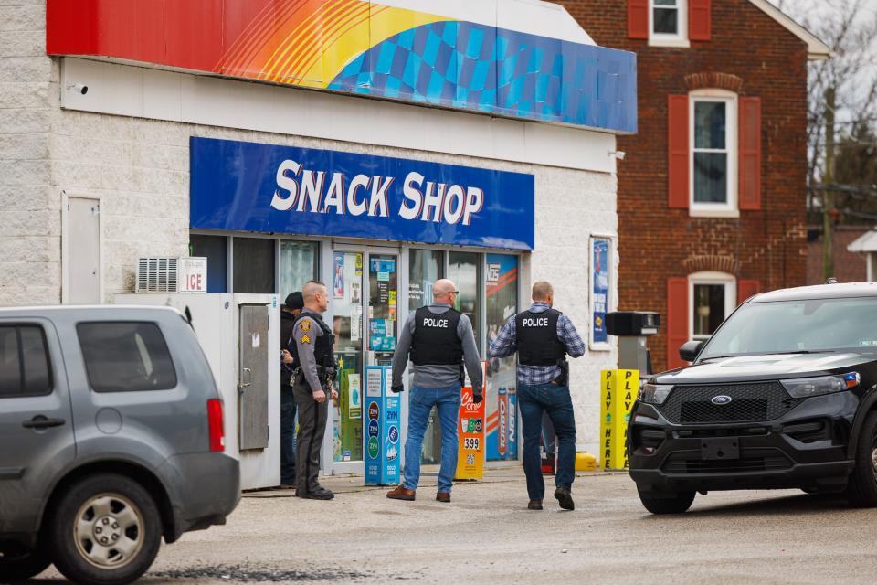 Police investigate the scene of a shooting at the Sunoco on the 400 block of Broadway, Friday, Feb. 2, 2024, in Hanover Borough.