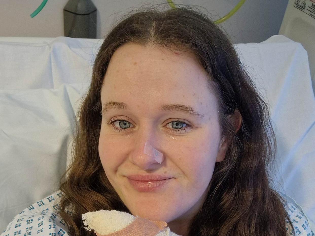 Crystal Rudd in hospital after having surgery on her finger. (SWNS)