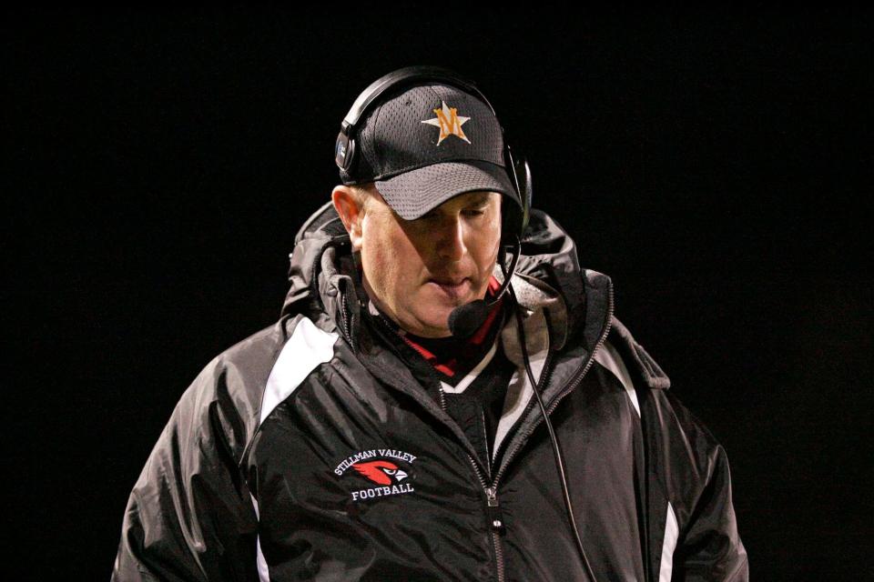 Stillman Valley football coach Mike Lalor, shown talking on his radio headgear during a game against Oregon on Sept. 23, 2011, has won five state titles with the Cardinals.