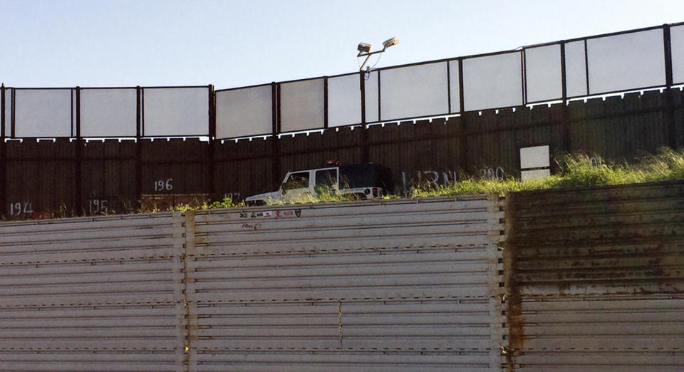 A Border Patrol vehicle sits alongside a border structure separating Tijuana, Mexico from San Diego Wednesday, Jan. 25, 2017. President Donald Trump moved aggressively to tighten the nation's immigration controls Wednesday, signing executive actions to jumpstart construction of his promised U.S.-Mexico border wall and cut federal grants for immigrant-protecting "sanctuary cities." (AP Photo/Julie Watson)