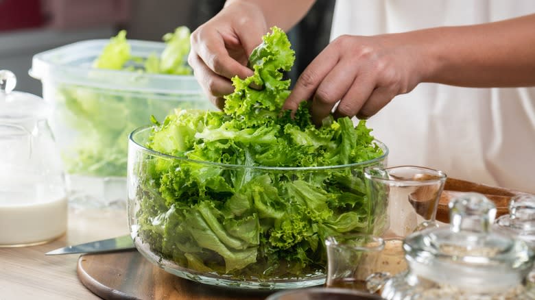 man handling a salad