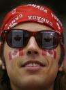 A Canadian supporter cheers before Canada plays the United States in their IIHF World Junior Championship ice hockey game in Malmo, Sweden, December 31, 2013. REUTERS/Alexander Demianchuk (SWEDEN - Tags: SPORT ICE HOCKEY)