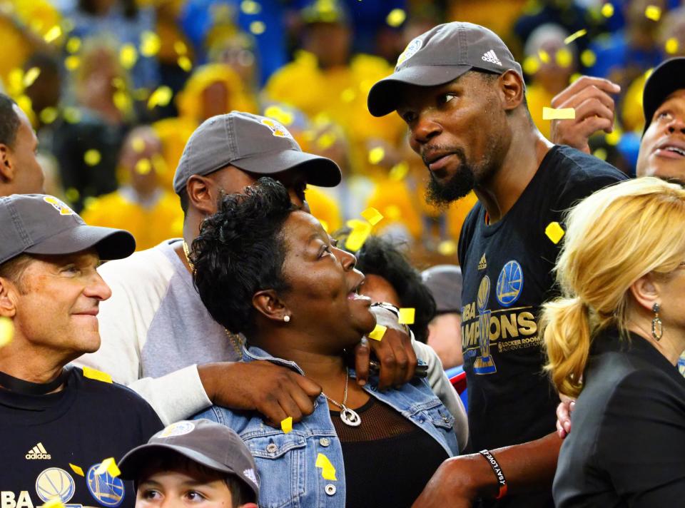 Golden State Warriors forward Kevin Durant celebrates with his mother, Wanda, after winning the 2017 NBA Finals in Oakland, Calif.