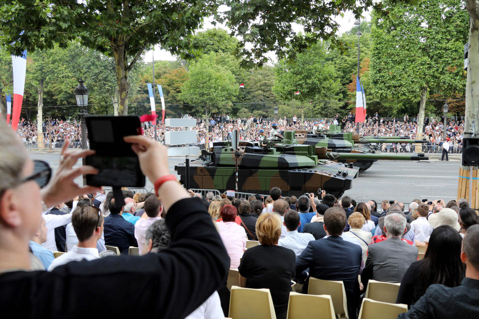 <p>People watch Leclerc main battle tanks during the military parade during Bastille Day celebrations on Champs Elysees avenue in Paris on July 14, 2017. (Photo: Ludovic Marin/AFP/Getty Images) </p>