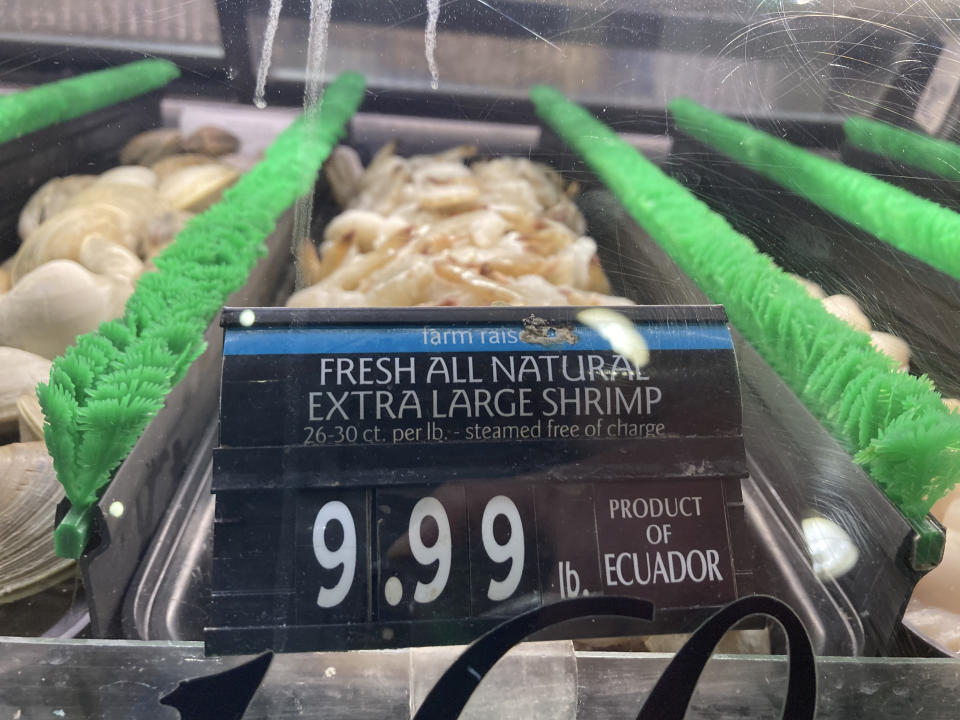 FILE - The price of shrimp is displayed at a market in Philadelphia, Thursday, June 16, 2022. Investors had few places to hide in 2022: Stocks and bonds both nose-dived and crypto tanked. Pocketbook issues were front and center for consumers as prices for food, energy and rent jumped. (AP Photo/Matt Rourke, File)