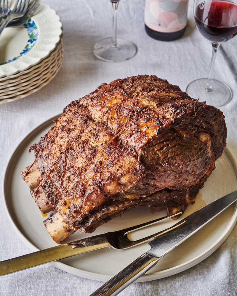 rib roast on a plate with utensils