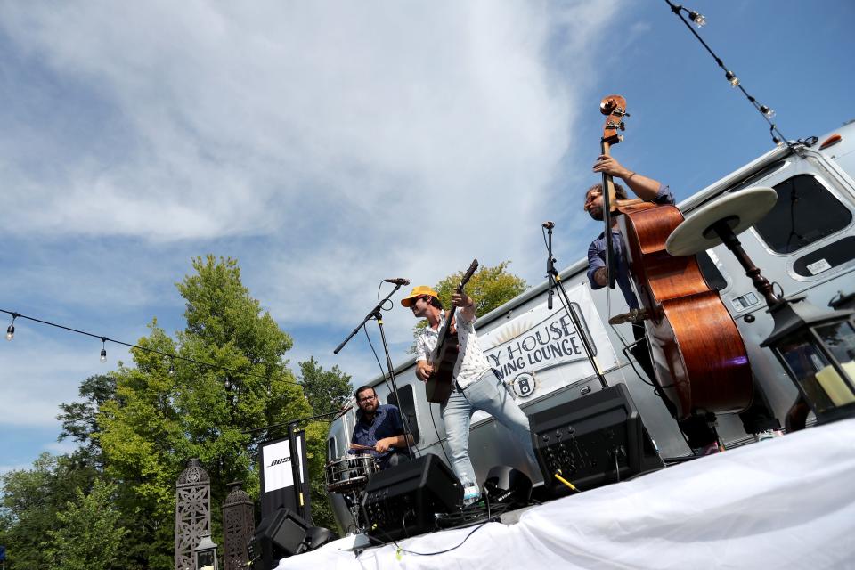 Jamie Kent performs a pop-up show at the Tiny House Listening Lounge in the Lawn at Ormsby Hall during Day 2 of the 7th annual Mile of Music Festival Friday, Aug. 2, 2019, in Appleton, Wis.