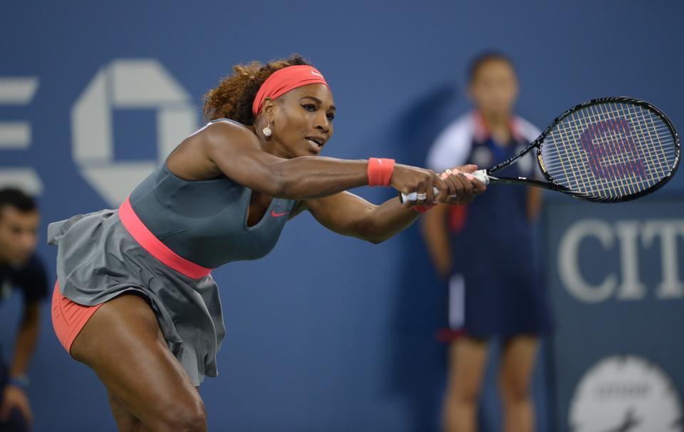 US tennis player Serena Williams returns a point to Italy's Francesca Schiavone during their 2013 US Open women's singles match at the USTA Billie Jean King National Tennis Center in New York on August 26 , 2013        (Photo credit should read EMMANUEL DUNAND/AFP/Getty Images)