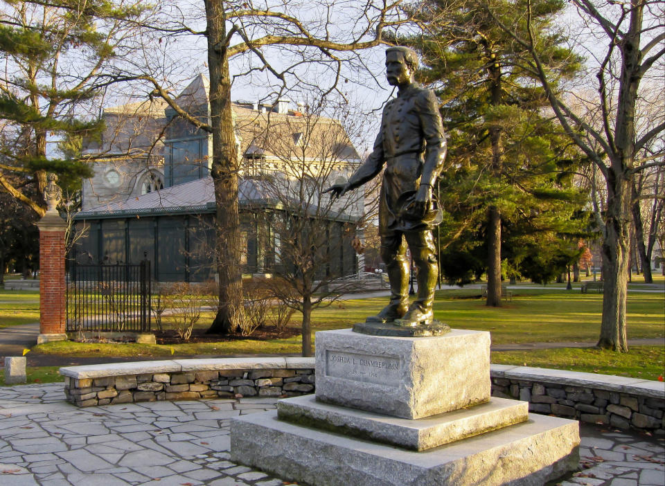 This undated photo supplied by the Brunswick Downtown Association shows a statue of Joshua Chamberlain in Brunswick, Maine, with the campus of Bowdoin College in the background. Chamberlain, a graduate of Bowdoin College and a professor there, led the Union's defense of Little Round Top at the Battle of Gettysburg during the Civil War and accepted the Confederacy’s surrender at Appomattox in Virginia in 1865. (AP Photo/Brunswick Downtown Association/Benjamin Williamson)