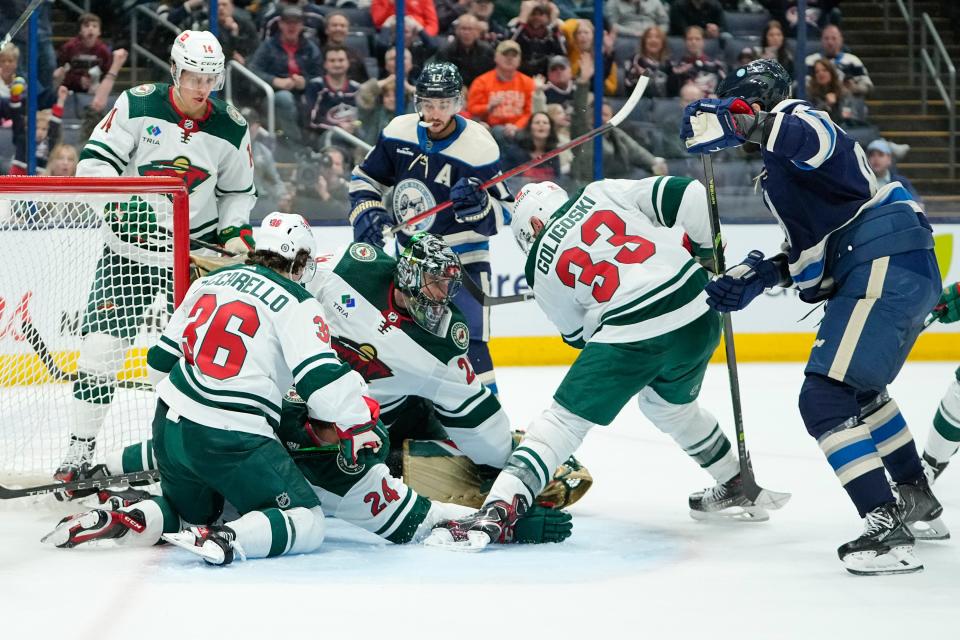 Feb 23, 2023; Columbus, Ohio, USA;  Minnesota Wild goaltender Marc-Andre Fleury (29) stops a frantic shot from Columbus Blue Jackets right wing Kirill Marchenko (86) in heavy net traffic during the third period of the NHL hockey game at Nationwide Arena. The Blue Jackets lost 2-0. Mandatory Credit: Adam Cairns-The Columbus Dispatch