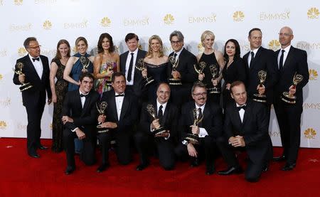 The cast and crew of AMC's "Breaking Bad" pose with their outstanding drama series award at the 66th Primetime Emmy Awards in Los Angeles, California August 25, 2014. REUTERS/Mike Blake