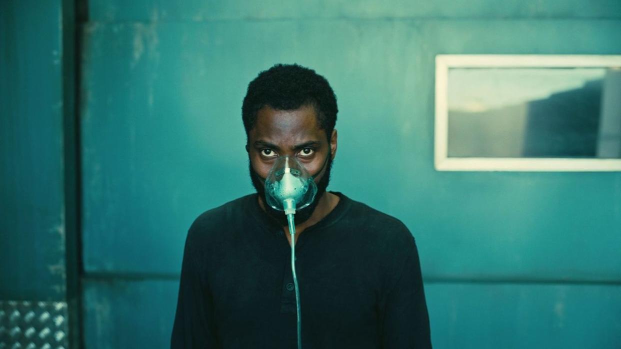 John David Washington wears a mask in a still from Tenet