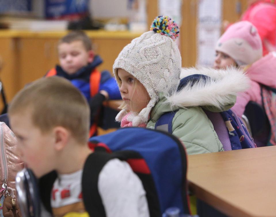 Sydney Harris watches a cartoon before the end of the school day at Tuslaw Elementary School on Friday. Masks are optional for students in the district.