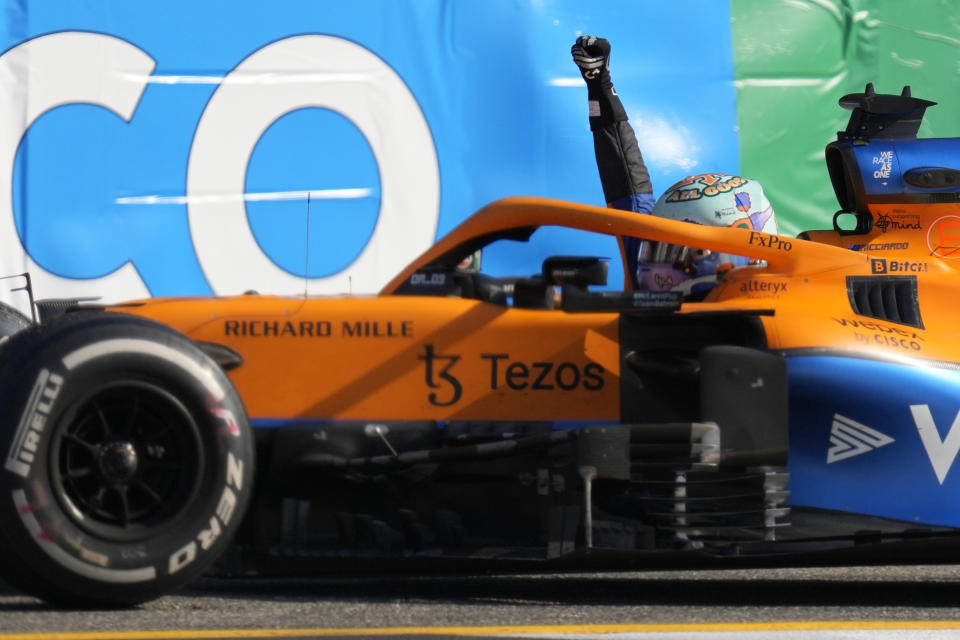 Mclaren driver Daniel Ricciardo of Australia celebrates after winning the Italian Formula One Grand Prix, at Monza racetrack, in Monza, Italy, Sunday, Sept.12, 2021. (AP Photo/Antonio Calanni)