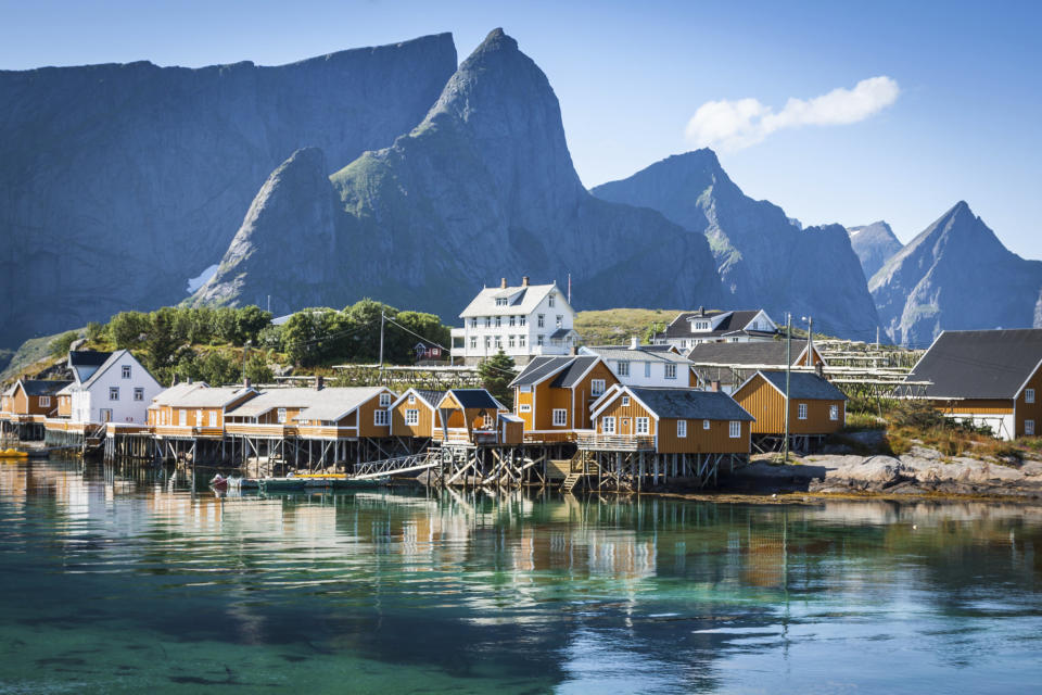 A typical Norwegian fishing village with traditional red rorbu huts in&nbsp;Reine, Lofoten Islands