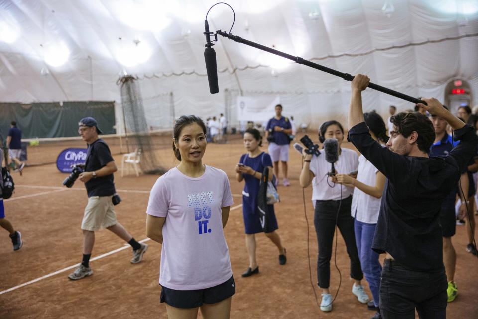 Two-time Grand Slam champion Li Na takes questions from the media at the Sutton East Tennis Club Thursday, July 18, 2019, in New York. Li Na will be inducted into the Tennis Hall of Fame on Saturday, July 20. (AP Photo/Kevin Hagen)