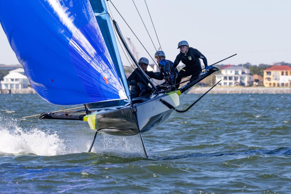 International teams of young sailors race in a foiling 69F sailboat in Pensacola Bay as part of a race hosted by Pensacola Yacht Club over Veteran's Day weekend.