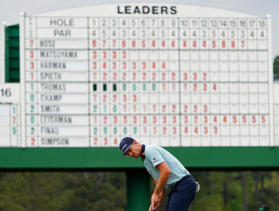 Justin Rose putts on the 17th green during Friday's second round of The Masters. He holds a one-stroke lead after 36 holes.