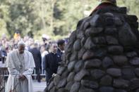 Pope Francis stops for a moment of prayer during his visit to the Museum of Occupations and Freedom Fights, in Vilnius, Lithuania, Saturday, Sept. 22, 2018. Francis began his second day in the Baltics in Lithuania's second city, Kaunas, where an estimated 3,000 Jews survived out of a community of 37,000 during the 1941-1944 Nazi occupation. (AP Photo/Andrew Medichini)