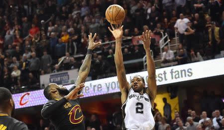 Jan 21, 2017; Cleveland, OH, USA; San Antonio Spurs forward Kawhi Leonard (2) shoots over the defense of Cleveland Cavaliers forward LeBron James (23) during the second half at Quicken Loans Arena. Mandatory Credit: Ken Blaze-USA TODAY Sports
