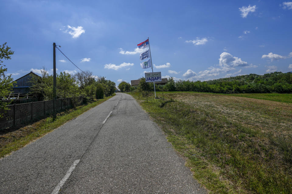 A sign saying: "We won't give Jadar" on a road in the village of Gornje Nedeljice, in the fertile Jadar Valley in western Serbia, Tuesday, Aug. 6, 2024. (AP Photo/Darko Vojinovic)