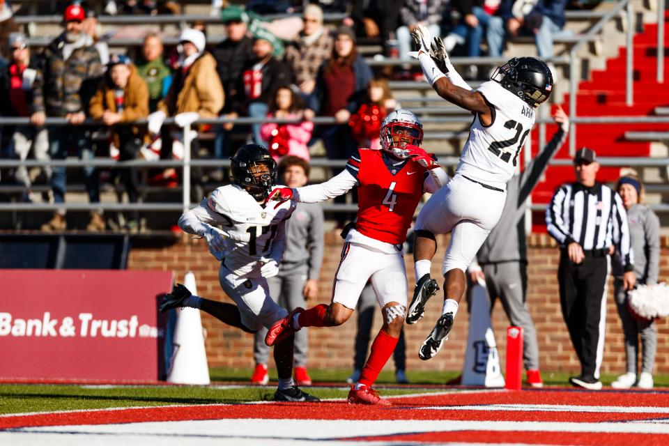 Army's Marquel Broughton (20) breaks up a pass play intended for Liberty receiver C.J. Daniels (4). ELLIE RICHARDSON/For Liberty Athletics