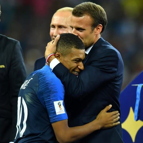 Mr Macron kissed Kylian Mbappé on the head before France were presented with the cup - Credit: DYLAN MARTINEZ/ REUTERS