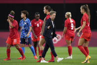 FILE - Canada coach Bev Priestman greets her players after they tied with Japan during a women's soccer match at the 2020 Summer Olympics on July 21, 2021, in Sapporo, Japan. Priestman says the dispute between her players and the Canadian federation is weighing on the team as it prepares for Thursday's opening match of the SheBelieves Cup against the United States. (AP Photo/Silvia Izquierdo, File)